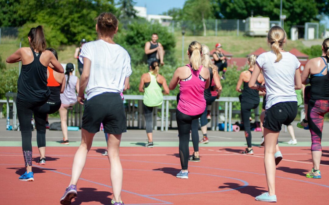 group of people exercising outdoors