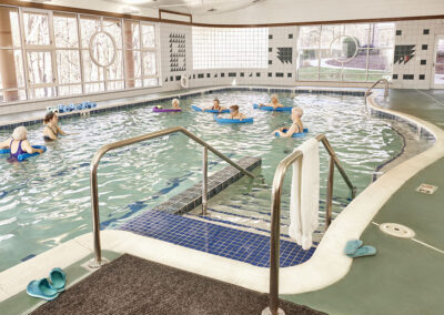 brookridge residents swimming in the indoor community pool