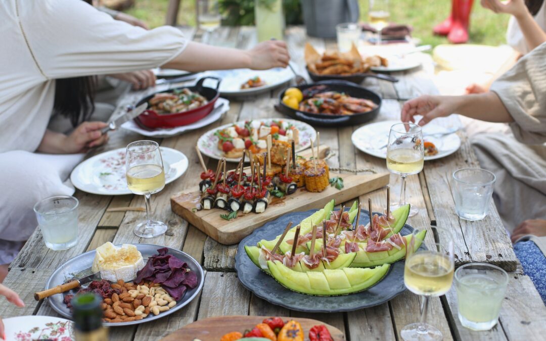 group of people eating an assortment of foods